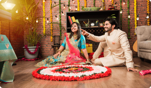 Indian Couple Making Flower Rangoli